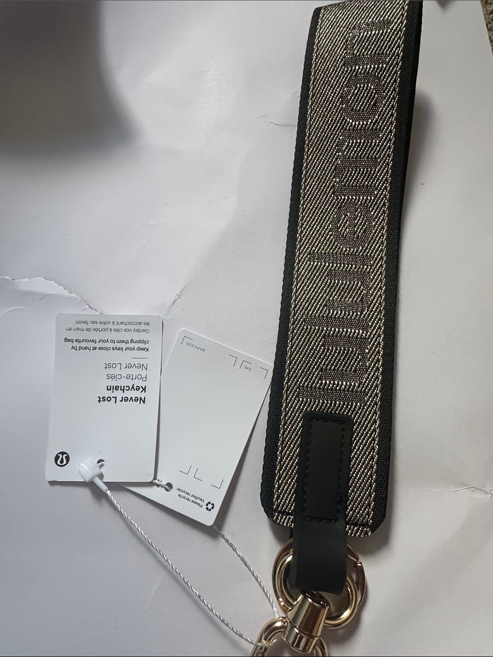 lululemon athletica Black and Beige Logo Woven Key Strap with Gold Hardware